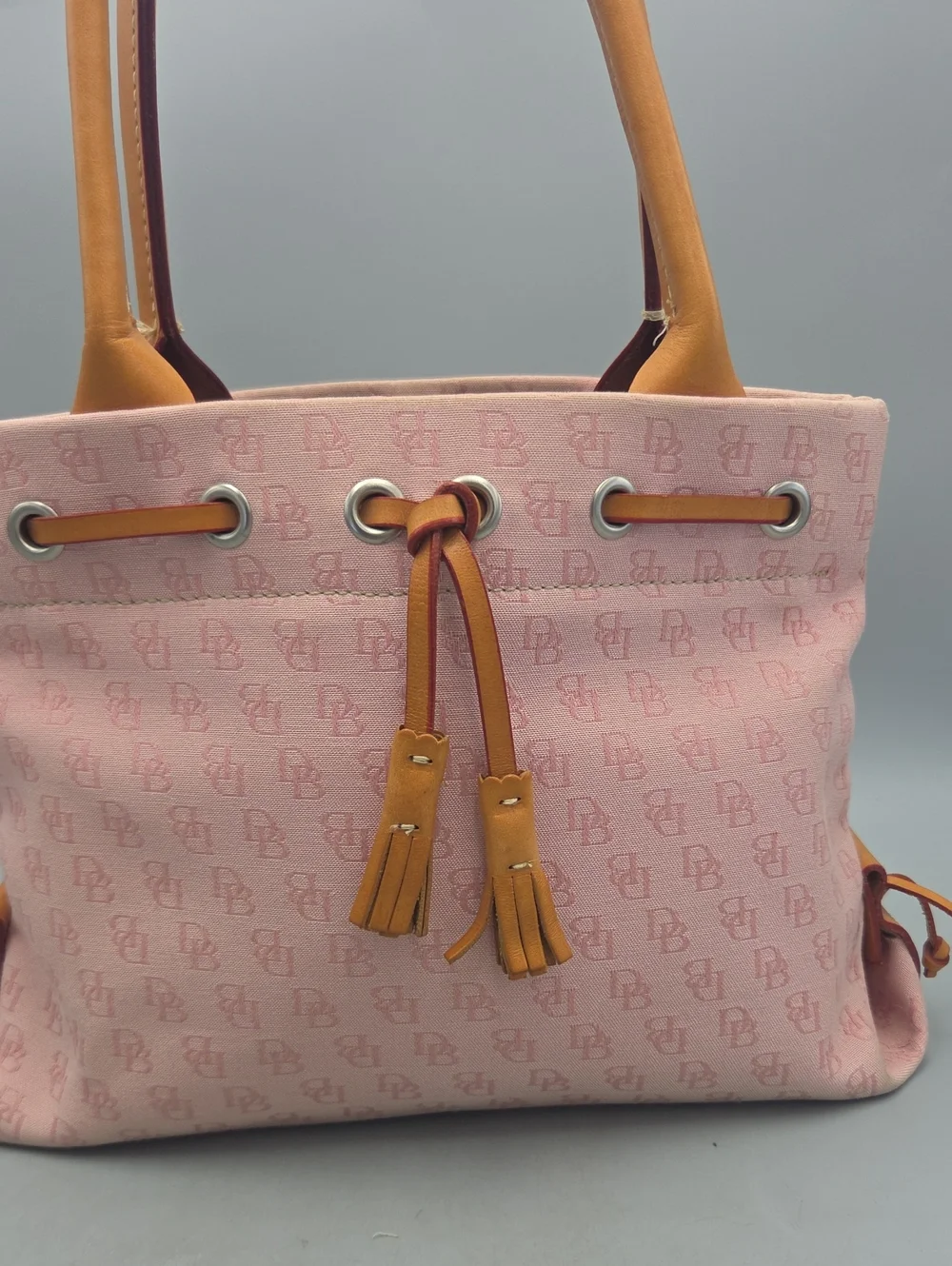 Dooney Bourke DB Monogram Drawstring Tote Canvas Leather Tassel Pink